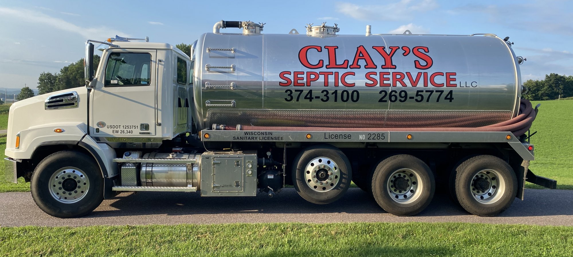 Clay's Septic Pumper Truck serving Monroe County WI and surrounding areas. On the side are phone numbers 347-3100 and 269-5774